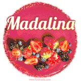Beautifully decorated red velvet berry birthday cake with vibrant fruits and a glowing 'Madalina' name, adding a touch of sweetness and sparkle.