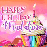 A vibrant birthday GIF featuring a rainbow-colored cupcake topped with white frosting, sprinkles, and a lit candle. The text reads 'Happy Birthday Madalina' in bold pink and violet letters with white outline.