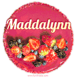 Beautifully decorated red velvet berry birthday cake with vibrant fruits and a glowing 'Maddalynn' name, adding a touch of sweetness and sparkle.
