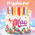 Personalized for Mae elegant birthday cake adorned with rainbow sprinkles, colorful candles and glitter