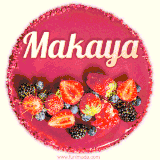 Beautifully decorated red velvet berry birthday cake with vibrant fruits and a glowing 'Makaya' name, adding a touch of sweetness and sparkle.