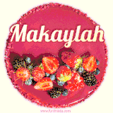 Beautifully decorated red velvet berry birthday cake with vibrant fruits and a glowing 'Makaylah' name, adding a touch of sweetness and sparkle.