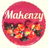 Beautifully decorated red velvet berry birthday cake with vibrant fruits and a glowing 'Makenzy' name, adding a touch of sweetness and sparkle.