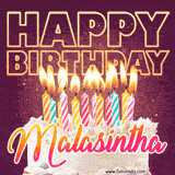 A colorful birthday cake topped with lit candles, with the words 'Happy Birthday Malasintha' in bold glowing letters on a burgundy background. Animated flames add a festive touch.