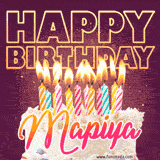 A colorful birthday cake topped with lit candles, with the words 'Happy Birthday Mapiya' in bold glowing letters on a burgundy background. Animated flames add a festive touch.