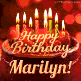 Beautifully decorated red velvet berry birthday cake with vibrant fruits and a glowing 'Marilyn' name, adding a touch of sweetness and sparkle.