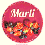 Beautifully decorated red velvet berry birthday cake with vibrant fruits and a glowing 'Marli' name, adding a touch of sweetness and sparkle.