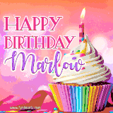A vibrant birthday GIF featuring a rainbow-colored cupcake topped with white frosting, sprinkles, and a lit candle. The text reads 'Happy Birthday Marlow' in bold pink and violet letters with white outline.