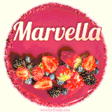Beautifully decorated red velvet berry birthday cake with vibrant fruits and a glowing 'Marvella' name, adding a touch of sweetness and sparkle.