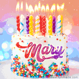 A cheerful white birthday cake with multicolor sprinkles, lit candles, and 'Mary' written in vibrant letters, in an animated GIF.