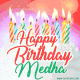 Bright birthday candles with rainbow flames on a cake, alongside the text 'Happy Birthday Medha' in vibrant script in this celebratory animated GIF.