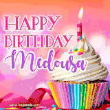 A vibrant birthday GIF featuring a rainbow-colored cupcake topped with white frosting, sprinkles, and a lit candle. The text reads 'Happy Birthday Medousa' in bold pink and violet letters with white outline.