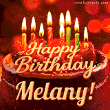Beautifully decorated red velvet berry birthday cake with vibrant fruits and a glowing 'Melany' name, adding a touch of sweetness and sparkle.