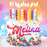 A cheerful white birthday cake with multicolor sprinkles, lit candles, and 'Melina' written in vibrant letters, in an animated GIF.