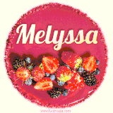Beautifully decorated red velvet berry birthday cake with vibrant fruits and a glowing 'Melyssa' name, adding a touch of sweetness and sparkle.