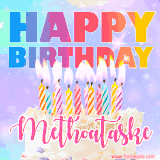 A vibrant animated name GIF with the words 'Happy Birthday Methoataske' with colorful candles on a creamy cake. The background sparkles with pastel shades, adding a festive touch.