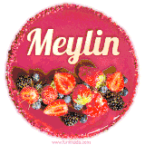 Beautifully decorated red velvet berry birthday cake with vibrant fruits and a glowing 'Meylin' name, adding a touch of sweetness and sparkle.