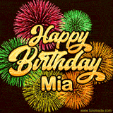 Golden text reading 'Happy Birthday Mia' surrounded by vibrant fireworks in red, green, and yellow, set against a dark background in this celebratory birthday GIF.