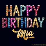 Vibrant luxury birthday greeting card for Mia, showing glittering gemstone letters and golden calligraphy on a dark background with twinkling shine effects.