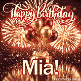 Bright gold and burgundy helium balloons hovering over a beautifully wrapped gift box with the name Mia