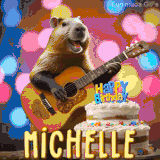 Animated birthday GIF showing a capybara playing guitar and singing beside a birthday cake with the name Michelle in large letters and colorful bokeh lights in the background.