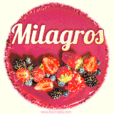 Beautifully decorated red velvet berry birthday cake with vibrant fruits and a glowing 'Milagros' name, adding a touch of sweetness and sparkle.