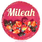 Beautifully decorated red velvet berry birthday cake with vibrant fruits and a glowing 'Mileah' name, adding a touch of sweetness and sparkle.