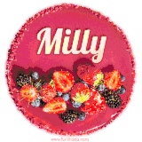 Beautifully decorated red velvet berry birthday cake with vibrant fruits and a glowing 'Milly' name, adding a touch of sweetness and sparkle.