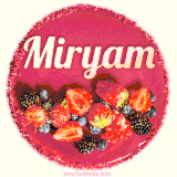 Beautifully decorated red velvet berry birthday cake with vibrant fruits and a glowing 'Miryam' name, adding a touch of sweetness and sparkle.