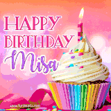 A vibrant birthday GIF featuring a rainbow-colored cupcake topped with white frosting, sprinkles, and a lit candle. The text reads 'Happy Birthday Misa' in bold pink and violet letters with white outline.