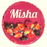 Beautifully decorated red velvet berry birthday cake with vibrant fruits and a glowing 'Misha' name, adding a touch of sweetness and sparkle.