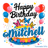 A gourmet birthday cake with colorful blossoms and butterfly toppers on a blue pedestal, custom-made for Mitchell.