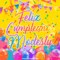 A bright and festive GIF with the text 'Feliz Cumpleaños Modesty' in Spanish in colorful fonts, surrounded by confetti, balloons, and festive banners on a vibrant yellow background.