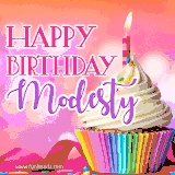 A vibrant birthday GIF featuring a rainbow-colored cupcake topped with white frosting, sprinkles, and a lit candle. The text reads 'Happy Birthday Modesty' in bold pink and violet letters with white outline.