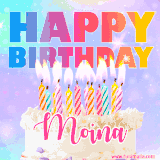 A vibrant animated name GIF with the words 'Happy Birthday Moina' with colorful candles on a creamy cake. The background sparkles with pastel shades, adding a festive touch.