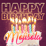 A colorful birthday cake topped with lit candles, with the words 'Happy Birthday Mojisola' in bold glowing letters on a burgundy background. Animated flames add a festive touch.
