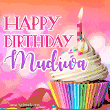 A vibrant birthday GIF featuring a rainbow-colored cupcake topped with white frosting, sprinkles, and a lit candle. The text reads 'Happy Birthday Mudiwa' in bold pink and violet letters with white outline.
