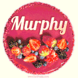 Beautifully decorated red velvet berry birthday cake with vibrant fruits and a glowing 'Murphy' name, adding a touch of sweetness and sparkle.