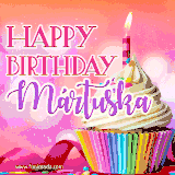A vibrant birthday GIF featuring a rainbow-colored cupcake topped with white frosting, sprinkles, and a lit candle. The text reads 'Happy Birthday Mártuska' in bold pink and violet letters with white outline.