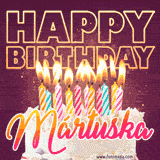 A colorful birthday cake topped with lit candles, with the words 'Happy Birthday Mártuska' in bold glowing letters on a burgundy background. Animated flames add a festive touch.