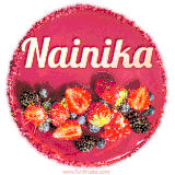 Beautifully decorated red velvet berry birthday cake with vibrant fruits and a glowing 'Nainika' name, adding a touch of sweetness and sparkle.