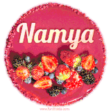 Beautifully decorated red velvet berry birthday cake with vibrant fruits and a glowing 'Namya' name, adding a touch of sweetness and sparkle.