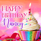 A vibrant birthday GIF featuring a rainbow-colored cupcake topped with white frosting, sprinkles, and a lit candle. The text reads 'Happy Birthday Nancy' in bold pink and violet letters with white outline.