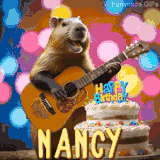Animated birthday GIF showing a capybara playing guitar and singing beside a birthday cake with the name Nancy in large letters and colorful bokeh lights in the background.
