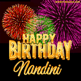 A golden 'Happy Birthday Nandini' message with vibrant fireworks in the background, creating a festive and celebratory vibe in this animated name GIF.