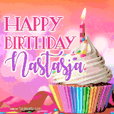 A vibrant birthday GIF featuring a rainbow-colored cupcake topped with white frosting, sprinkles, and a lit candle. The text reads 'Happy Birthday Nastasja' in bold pink and violet letters with white outline.