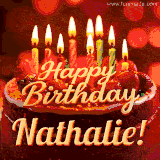 Beautifully decorated red velvet berry birthday cake with vibrant fruits and a glowing 'Nathalie' name, adding a touch of sweetness and sparkle.