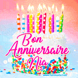 A white birthday cake covered in colorful sprinkles, topped with bright candles, and French text 'Bon Anniversaire Nia' on a pastel gradient background in an animated GIF.