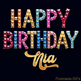 Vibrant luxury birthday greeting card for Nia, showing glittering gemstone letters and golden calligraphy on a dark background with twinkling shine effects.