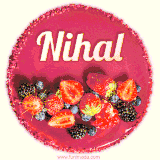 Beautifully decorated red velvet berry birthday cake with vibrant fruits and a glowing 'Nihal' name, adding a touch of sweetness and sparkle.